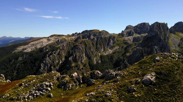 Aerial Panning Shot Of People Hiking On Mountain Top During Sunny Day - Plav, Montenegro