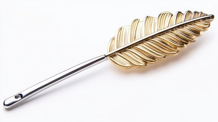 Artistic lapel pin shaped like a feather in gold and silver on white background