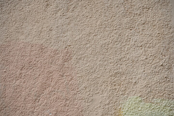 Rough wall with old paint stains.