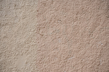 Rough wall with old paint stains.
