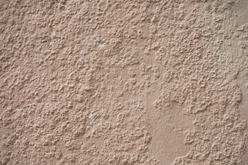 Rough wall with old paint stains.