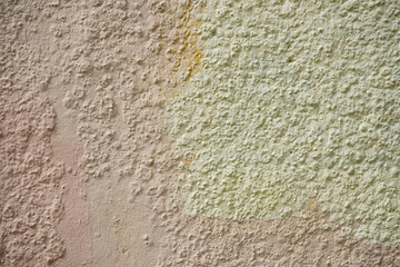 Rough wall with old paint stains.