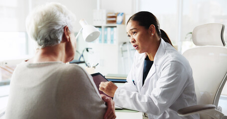Tablet, doctor and conversation with patient for healthcare report, test results or help. Medical...