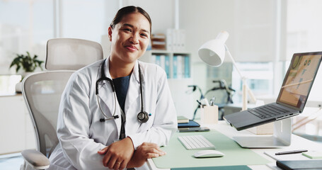 Portrait, happy woman and doctor in clinic, smile and laptop with confidence, career ambition and...