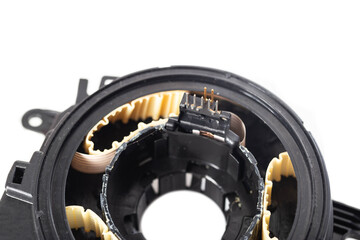 disassembled broken steering column electrical cable on white background, isolate, close-up
