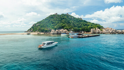 Tourist boats dock on the island in summer. © artrachen