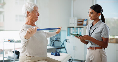 Obraz premium Elderly woman, physiotherapist and resistance band with stretching, smile and healthcare services for recovery. People, happy and exercise with tablet, help and injury for rehabilitation at clinic