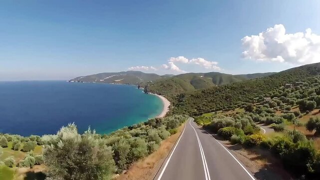 Car driving on scenic road in lefkas island with tranquil sea and green mediterranean hills on a bright sunny summer day.