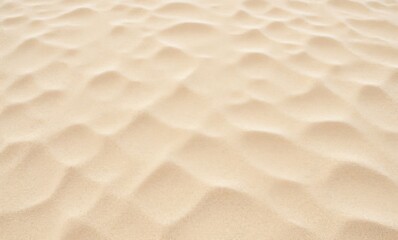 Smooth, golden sand texture with gentle undulations and soft shadows.