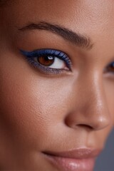 Obraz premium modern makeup close-up showcasing bold eyeliner on vibrant eyes with minimalist design