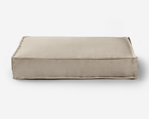 Comfortable pet bed resting on white background