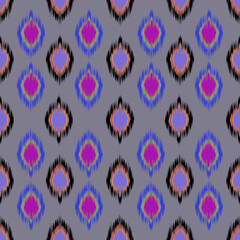 Ethnic abstract Ikat art seamless pattern in vector format. Featuring soft, blurred edges and geometric tribal-inspired shapes, this design captures the essence of traditional handwoven textiles. Perf