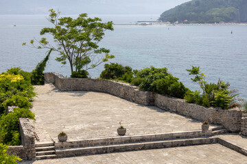 Tourists on the terrace of medieval fortress Citadel, Budva, Montenegro