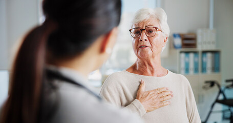Consulting, chest pain and healthcare with old woman and doctor for cardiac rehabilitation, heart arrhythmia or medical. Cardiologist, help and advice with people for healing and breathing exam