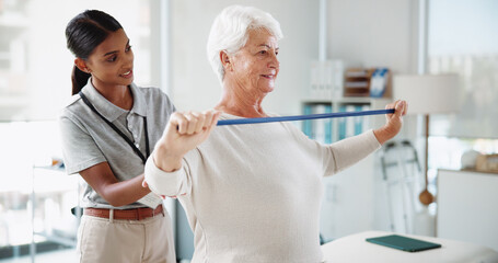 Obraz premium Senior woman, physiotherapist and resistance band with help, smile and healthcare services for recovery. People, happy and exercise with equipment, stretching and injury for rehabilitation at clinic