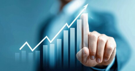A man's finger touches a growing graph, symbolizing business growth and success. This represents financial progress and reaching goals.