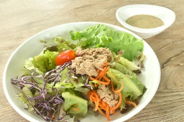 chop tuna with vegetable salad on plate dressing sesame oil japanese cream sauce