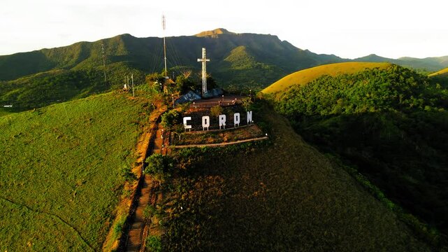 Aerial Panning Shot Of Cross Symbol On Top Of Mount Tapyas - Coron, Philippines