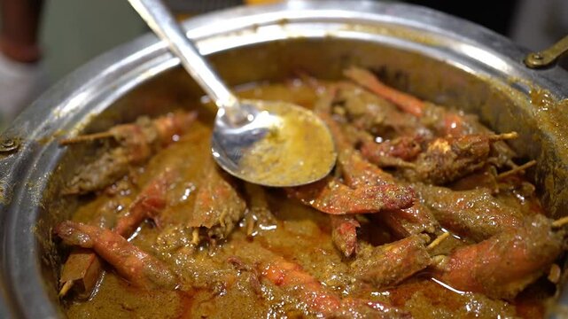 Prawn malai curry prepared in Bengali style in Indian wedding