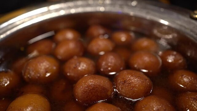 Close up shot of gulab jamun prepared in Bengali style in Indian wedding