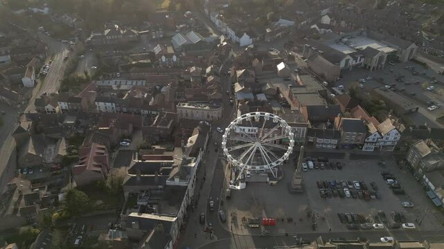 Breathtaking views of Ripon town featuring the iconic Ferris Wheel illuminated at sunset