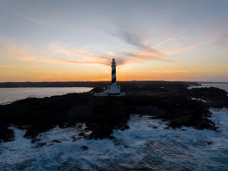 Faro de Favaritx al atardecer en la Isla de Menorca, Baleares