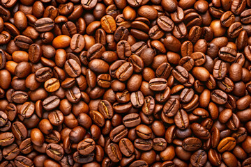 Obraz premium Brown coffee beans lot captured in closeup with focus on texture and roasted aroma