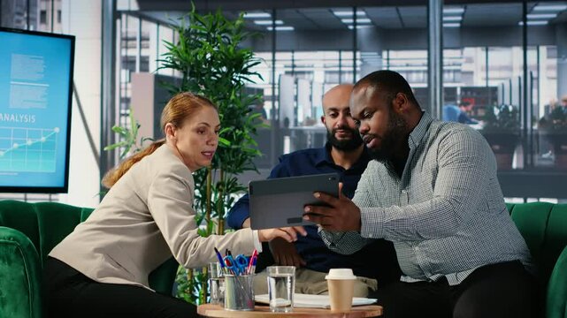 CEO and team members sharing foresight and leadership skills during briefing meeting, strategic thinking and cultural diversity to drive organizational growth. Corporate leaders. Camera B.