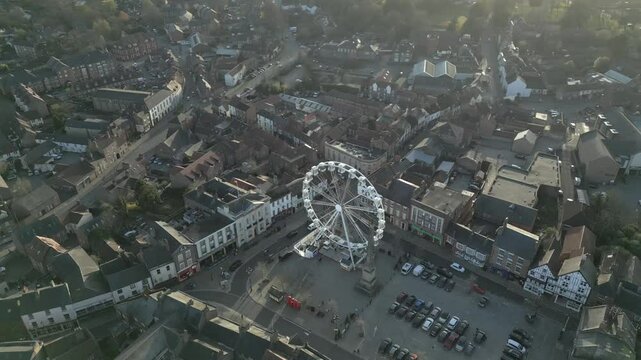 Cinematic view capturing the beauty of Ripon Cathedral and the iconic Ferris wheel against a serene backdrop during golden hour
