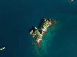 Aerial view A phinisi boat is sailing carrying tourists who will visit the islands around the waters of Labuan Bajo, East Nusa Tenggara, Indonesia.