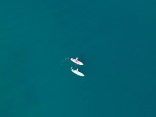 Aerial view A phinisi boat is sailing carrying tourists who will visit the islands around the waters of Labuan Bajo, East Nusa Tenggara, Indonesia.