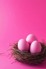 Obraz premium Soft pink eggs nestled in a rustic bird's nest on a vibrant magenta backdrop exuding warmth and tranquility