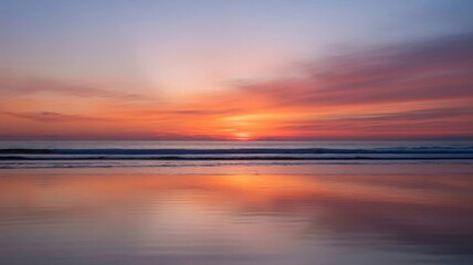 Sunrise Over Calm Ocean with Silky Water Reflection