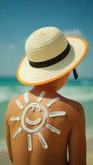 Child playing at beach with sun hat and smiley sun on back