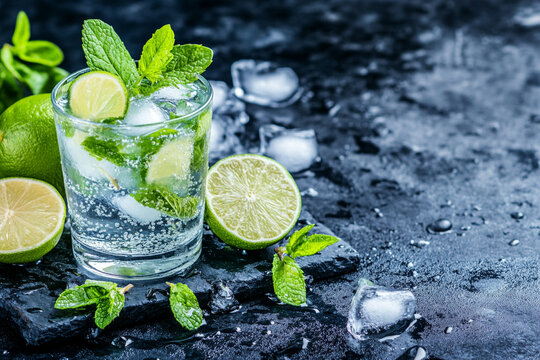 Refreshing mojito cocktail garnished with fresh lime and mint leaves for a lively summer experience