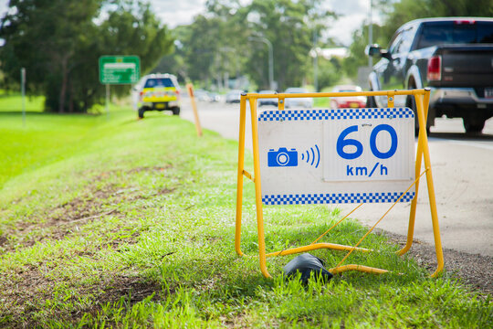 Police speed camera 60 km speed zone sign beside highway