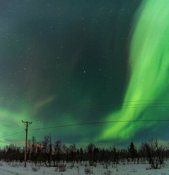 Aurora Borealis lighting up the night sky near Kiruna, Sweden