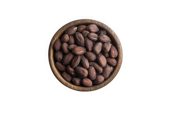 Fototapeta premium Top view of fresh shelled pilinuts in wooden bowl healthy snack delicious nutritious isolated on transparent background
