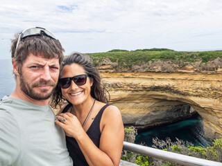 Man and Woman Enjoying Scenic Ocean View in the Twelve Apostles