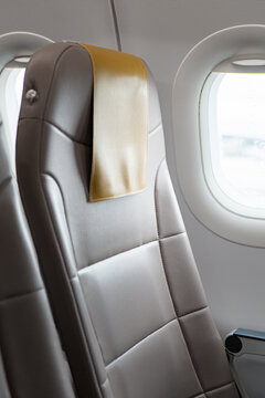 Modern airplane seat with window view
