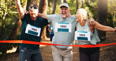 Win, people running and help to finish line for exercise aid, fitness or champion in forest. Mature...