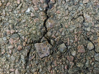 Road, car driveway, asphalt floor, concrete, with cracks, damage. indonesia. For digital works, websites, wallpapers, backgrounds and social media use.