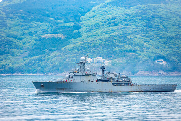 A South Korean navy frigate in grey camouflage returns to base after a coastal patrol mission near...