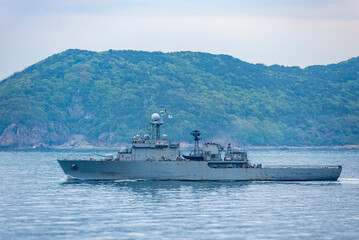 A South Korean navy frigate in grey camouflage returns to base after a coastal patrol mission near the port of Busan &ndash; a quiet moment after completing its maritime duty.