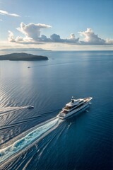 Aerial view of yacht sailing in deep blue sea