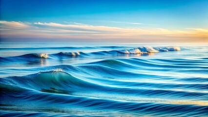 Fototapeta premium Serene Ocean Waves at Dawn A Captivating Display of Blue Hues and Gentle Rolling Surf Under a Peaceful Sky