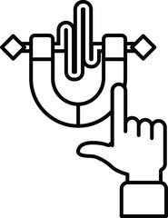 A hand pointing at a magnet