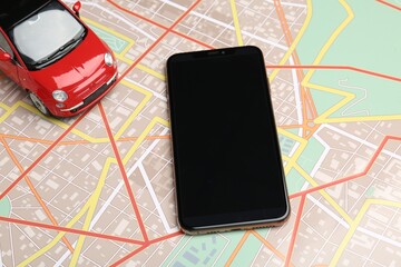 Road trip concept. Smartphone and car model on city map