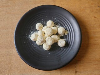 Kue Putri salju or Snow princess cookies ia an Indonesian kue kering or cookies,covered with...