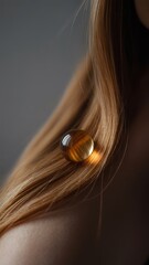 Obraz premium Artistic close-up of woman's hair with glowing object on shoulder
